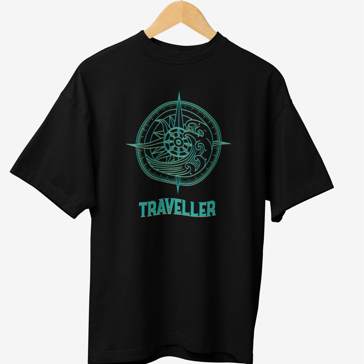 Black travel t-shirt featuring a turquoise compass design with intricate wave patterns and the word 'TRAVELLER' in bold, stylish typography.
