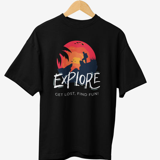 Black travel t-shirt featuring an adventure-themed design with the word 'EXPLORE' in bold, rugged font, a silhouette of a hiker against a sunset, and the phrase 'GET LOST, FIND FUN!