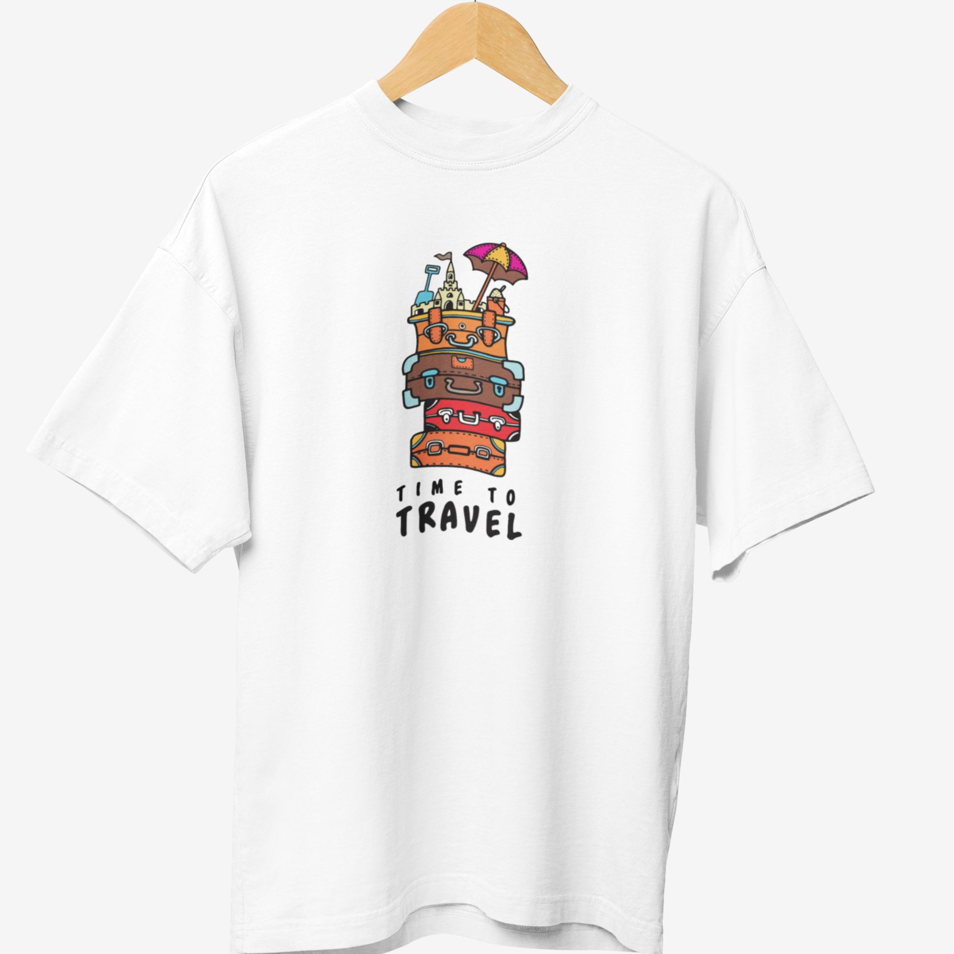 White travel t-shirt featuring a colorful graphic of stacked suitcases with famous landmarks, an umbrella, and the phrase 'Time to Travel' in playful typography.